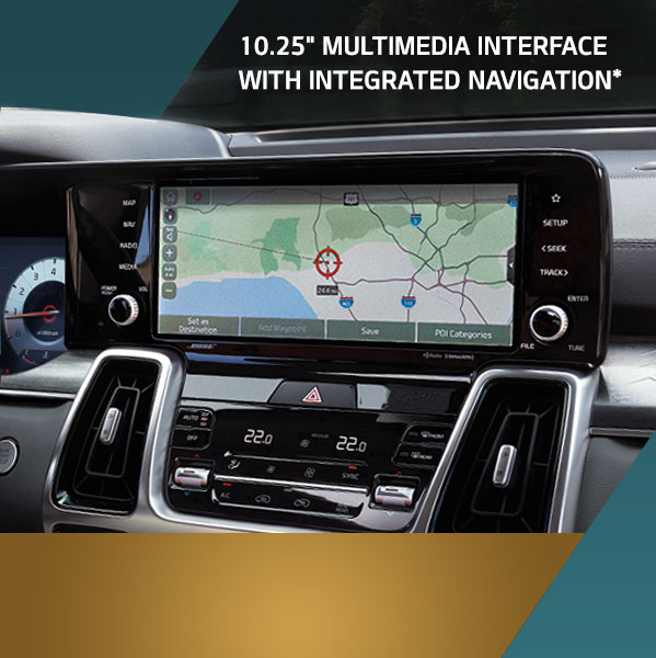 dashboard of Sorento in a sunny lakeside scene with touchscreen displaying navigation interface. 10.25" MULTIMEDIA INTERFACE WITH INTEGRATED NAVIGATION*